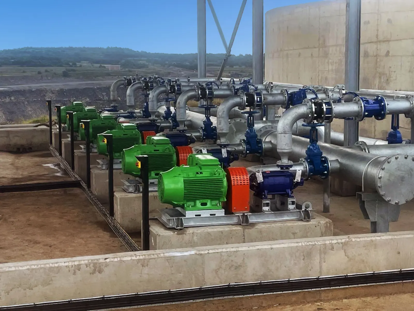 Row of industrial pumps installed in a pump station